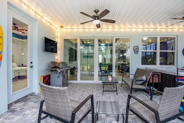 sunroom / solarium with ceiling fan