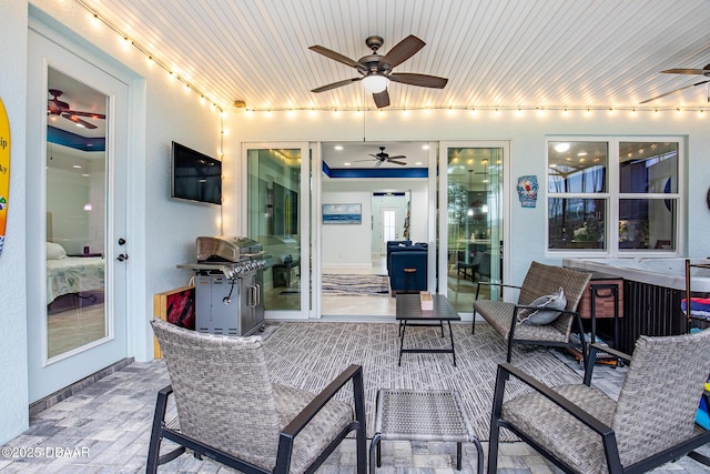 view of patio / terrace with ceiling fan and area for grilling