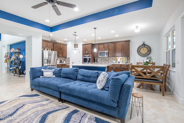 tiled living room featuring ceiling fan