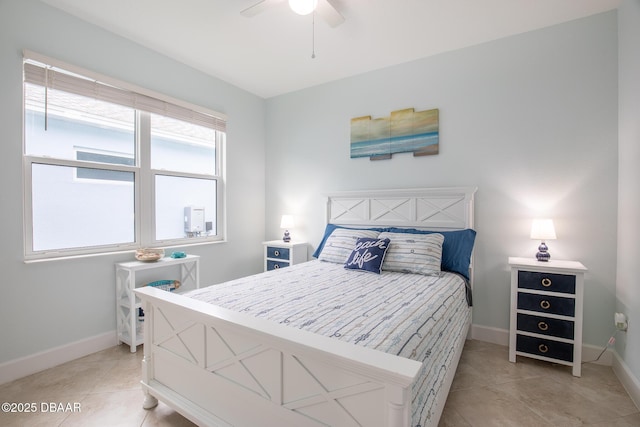 tiled bedroom with ceiling fan