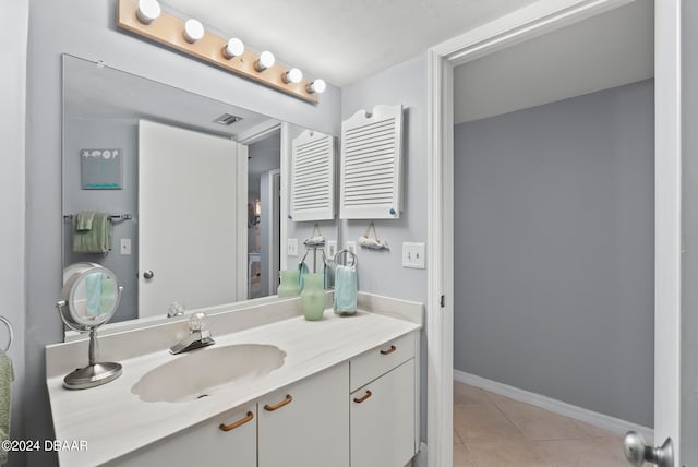 bathroom with vanity and tile patterned floors