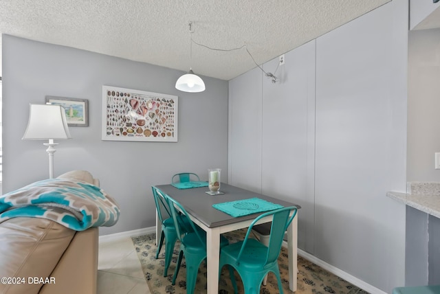 dining room featuring a textured ceiling