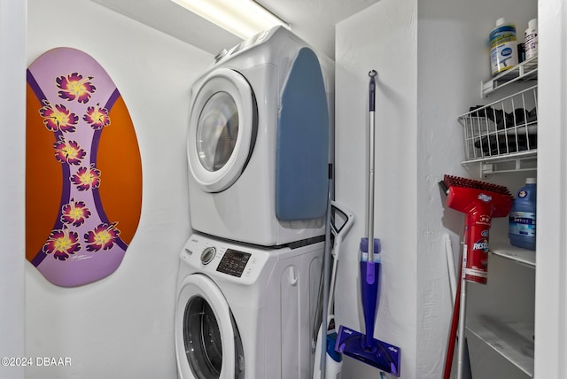 laundry area with stacked washer and dryer