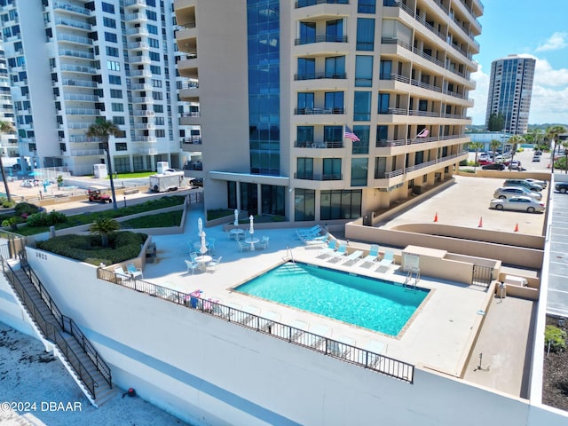 view of swimming pool featuring a patio area