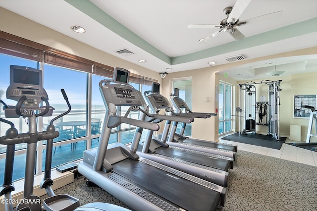 workout area with light carpet and ceiling fan