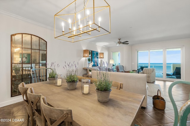 dining area featuring ceiling fan, a water view, and ornamental molding