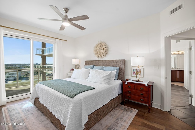 bedroom featuring access to outside, ensuite bath, ceiling fan, and dark hardwood / wood-style floors