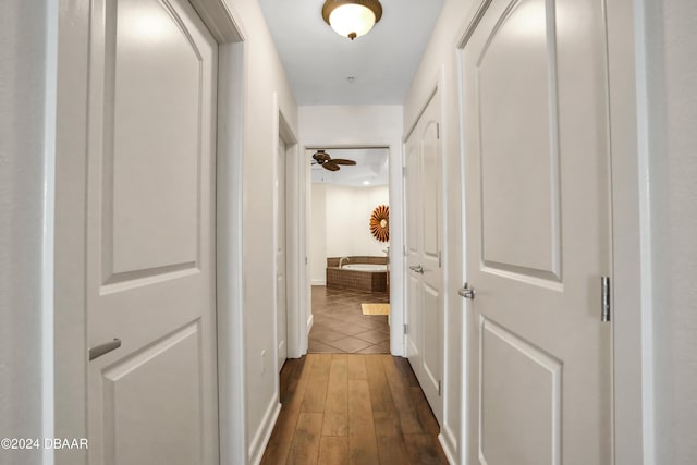 hall with dark wood-type flooring