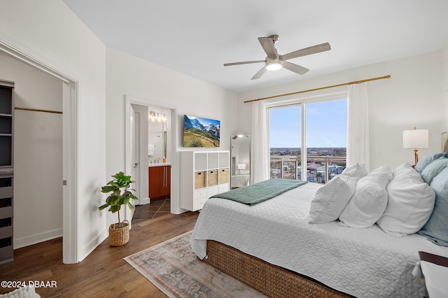 bedroom with ceiling fan, dark hardwood / wood-style flooring, and connected bathroom