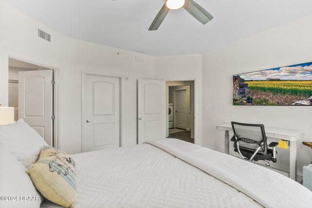 bedroom with ceiling fan and washer / clothes dryer