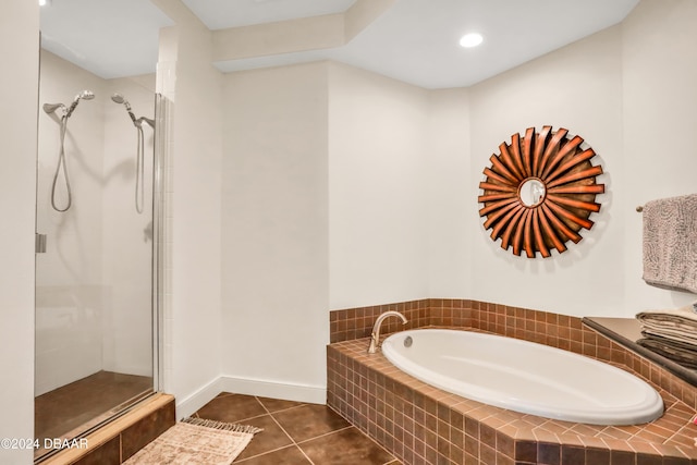 bathroom with tile patterned flooring and separate shower and tub