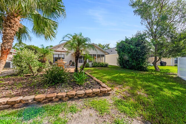 916 Ashmeade Ct, Port Orange, FL 32127 - view of grassy yard featuring a sunroom and a patio