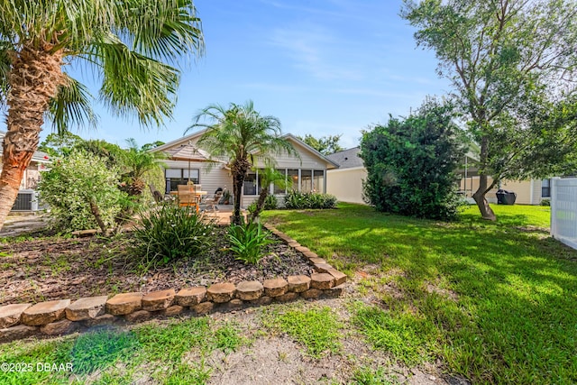 916 Ashmeade Ct, Port Orange, FL 32127 - view of grassy yard featuring a sunroom and a patio