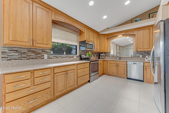 916 Ashmeade Ct, Port Orange, FL 32127 - kitchen featuring stainless steel appliances, vaulted ceiling, backsplash, light countertops, and recessed lighting