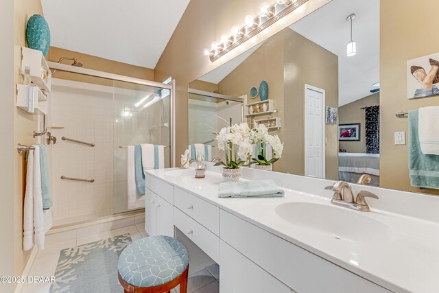 916 Ashmeade Ct, Port Orange, FL 32127 - full bath with connected bathroom, double vanity, a stall shower, lofted ceiling, and tile patterned floors