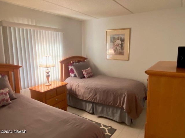 bedroom with light tile patterned flooring