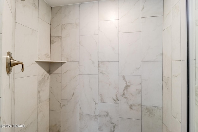 room details with a tile shower