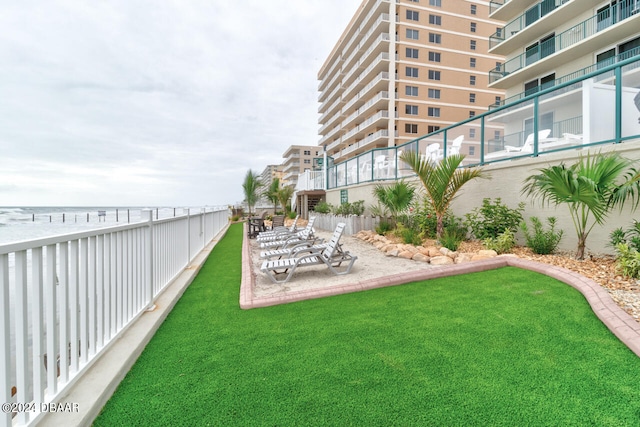 view of yard with a balcony