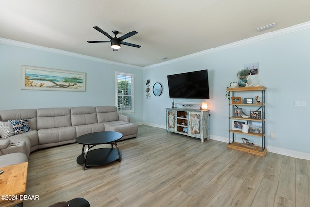 living room with crown molding, ceiling fan, and light hardwood / wood-style flooring