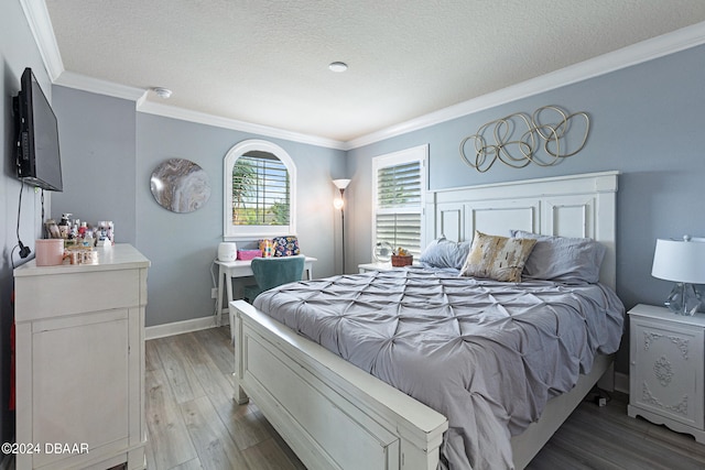 bedroom with a textured ceiling, ornamental molding, and light hardwood / wood-style flooring