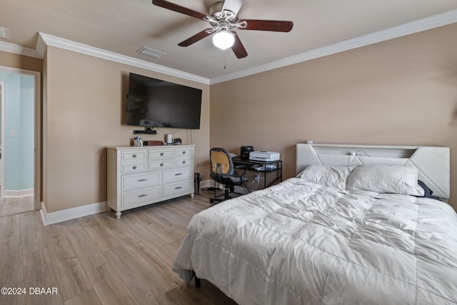 bedroom featuring light hardwood / wood-style floors, ceiling fan, a textured ceiling, and crown molding