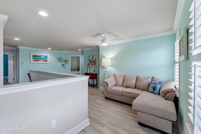 living room with ornamental molding, light hardwood / wood-style flooring, and ceiling fan