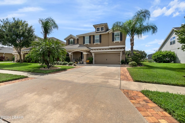 view of front of home with a garage and a front yard