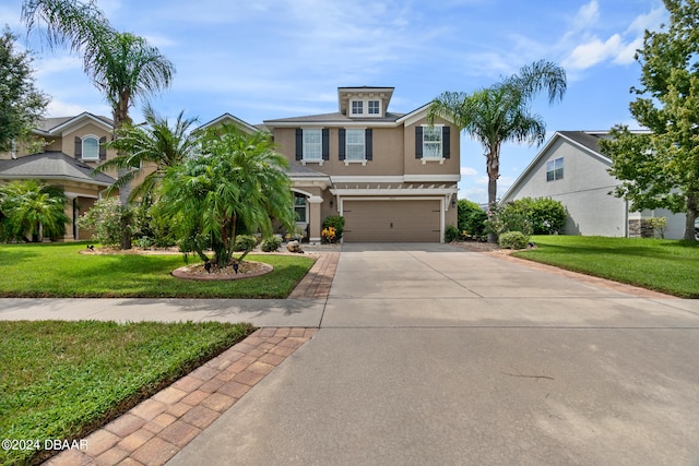 view of front facade with a front lawn and a garage