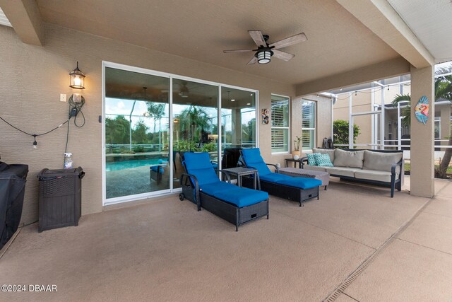 view of patio featuring an outdoor hangout area and ceiling fan