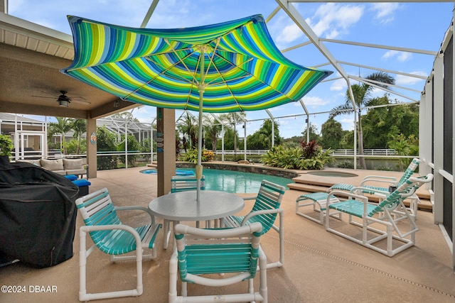 view of swimming pool featuring a lanai, grilling area, ceiling fan, and a patio