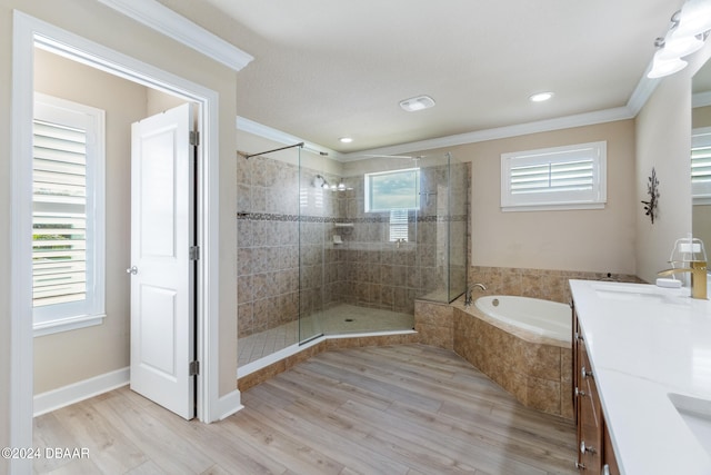 bathroom with shower with separate bathtub, wood-type flooring, and crown molding