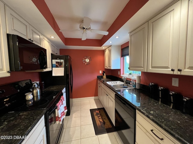 kitchen with black appliances, light tile patterned floors, sink, ceiling fan, and a raised ceiling