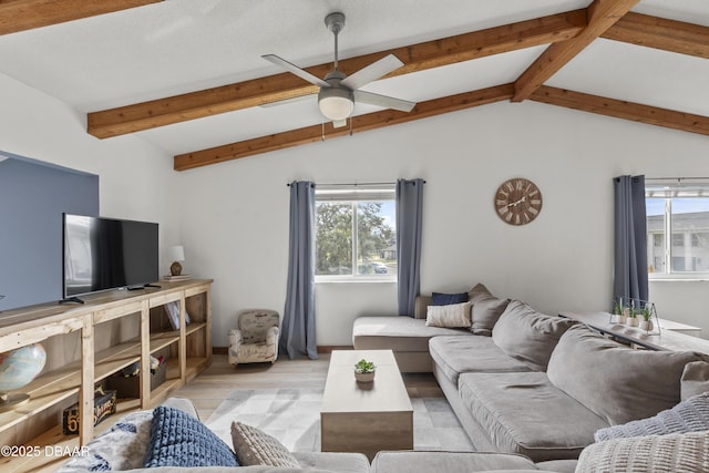 living room featuring ceiling fan, lofted ceiling with beams, and light hardwood / wood-style flooring