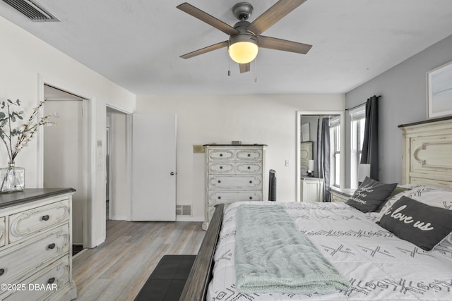 bedroom with ceiling fan and light hardwood / wood-style floors