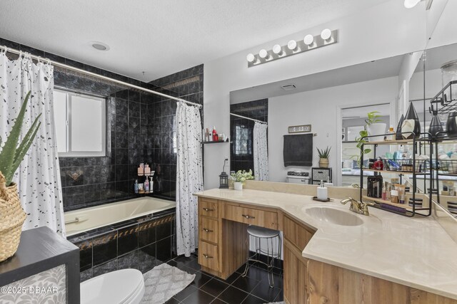 full bathroom with toilet, a textured ceiling, tile patterned flooring, shower / tub combo with curtain, and vanity