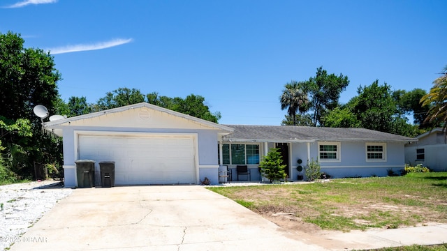 1325 Laurel Dr, Daytona Beach, FL 32117 - ranch-style home with an attached garage, stucco siding, and driveway