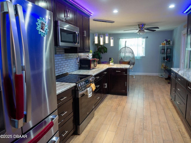 1325 Laurel Dr, Daytona Beach, FL 32117 - kitchen featuring stainless steel appliances, ceiling fan, tasteful backsplash, baseboards, and light stone countertops