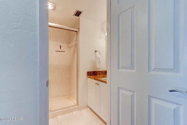 bathroom with vanity, tile patterned floors, and an enclosed shower