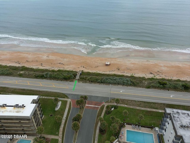 aerial view featuring a water view and a view of the beach