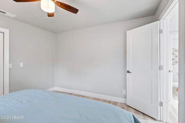 unfurnished bedroom featuring ceiling fan and light wood-type flooring