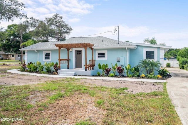 ranch-style house with a pergola