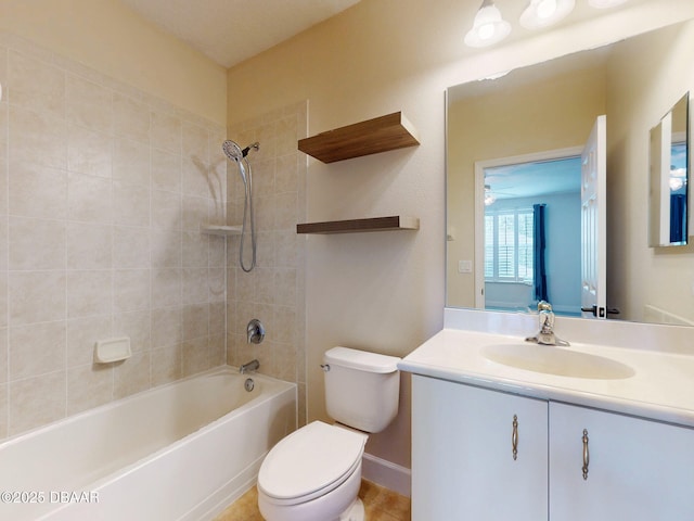 bathroom featuring vanity, shower / bathtub combination, and toilet