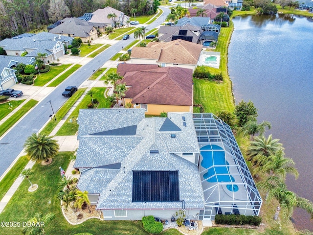 bird's eye view with a water view and a residential view
