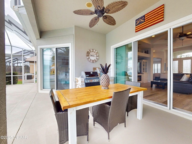 exterior space with a lanai, a ceiling fan, outdoor dining area, and a grill