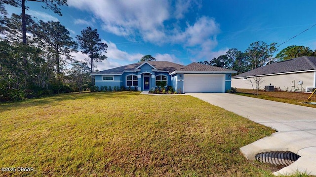 ranch-style house featuring a garage, a front lawn, and central air condition unit