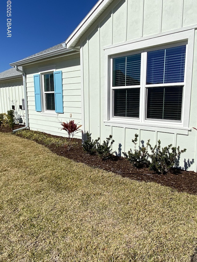 view of home's exterior with a lawn