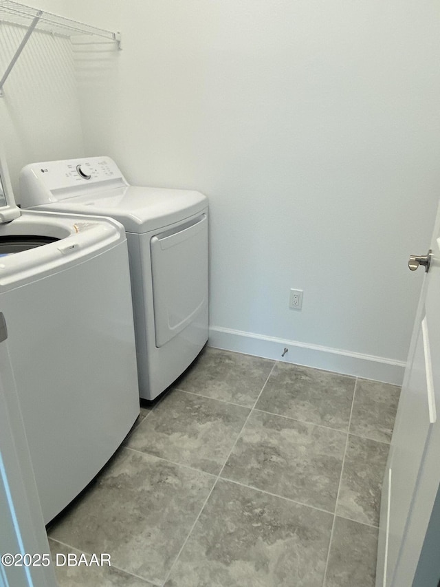 laundry area with independent washer and dryer