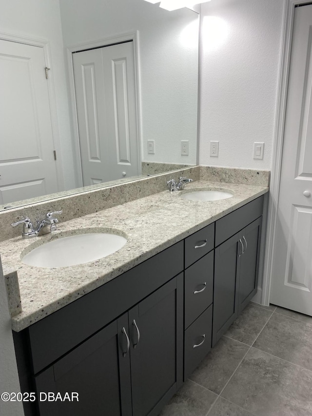 bathroom with tile patterned flooring and vanity