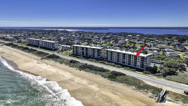 bird's eye view featuring a view of the beach and a water view