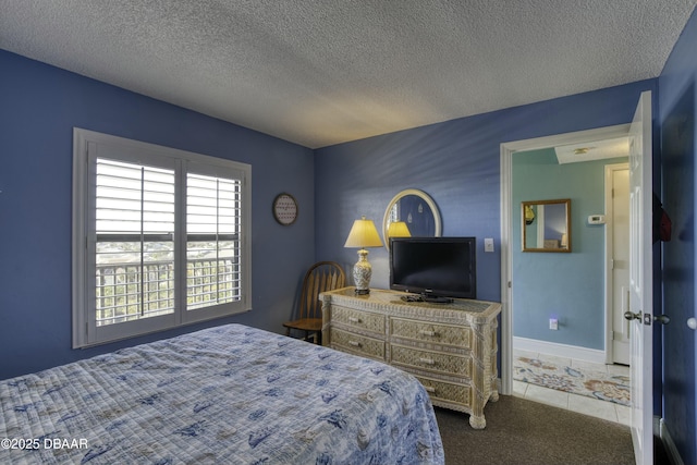 bedroom featuring a textured ceiling and carpet flooring